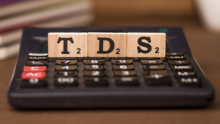 an analog calculator with TDS wooden blocks