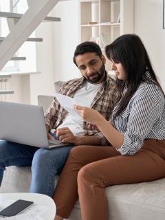 Person using laptop applying for a personal loan